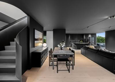 spotlights and recessed lighting through living room and kitchen